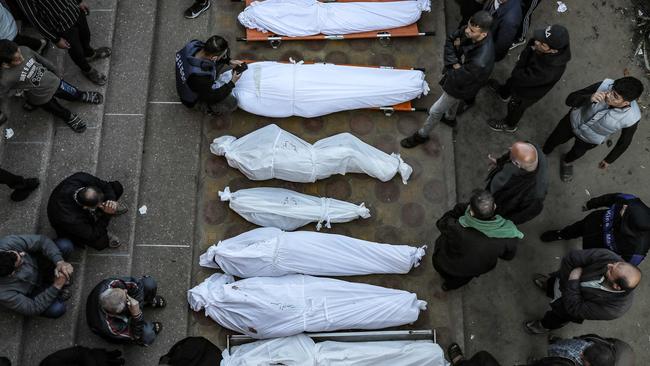 Mourners stand by shrouded bodies of relatives killed following Israeli strikes, at Khan Yunis's Nasser hospital in the southern Gaza Strip. Picture: AFP