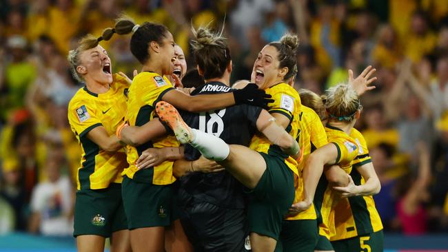 Matildas players celebrate winning the FIFA Womens World Cup Quarter final match between against France at Brisbane Stadium. Picture Lachie Millard