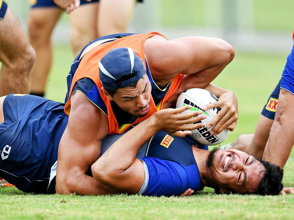 Jeremiah Nanai is worked over by Jordan McLean. Picture: Alix Sweeney