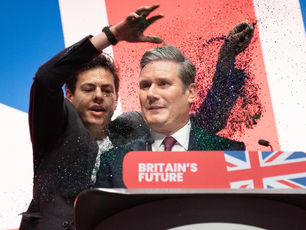 A protester throws glitter over Labour leader Sir Keir Starmer before his keynote speech at the Labour Party Conference in Liverpool. Picture: Stefan Rousseau/PA Images