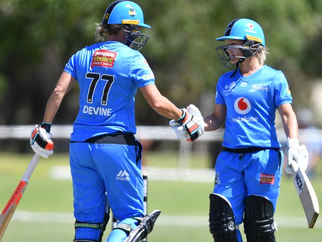 Sophie Devine celebrates scoring 50 runs with Bridget Patterson during the WBBL match between the Melbourne Stars and the Adelaide Strikers at Centennial Park Oval in Nuriootpa. Picture: AAP image/David Mariuz.