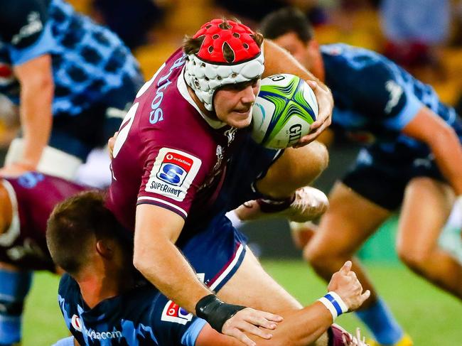 Reds' Fraser McReight (top) is tackled by Bulls' Ivan van Zyl during the Super Rugby match between Australia's Queensland Reds and South Africa's Bulls in Suncorp Stadium, Brisbane on March 14, 2020. (Photo by Patrick HAMILTON / AFP) / -- IMAGE RESTRICTED TO EDITORIAL USE - STRICTLY NO COMMERCIAL USE --