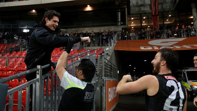 Collingwood's Tom Phillips gestures to a fan as he leaves the field during the Collingwood and Hawthorn game at Giants Stadium. Picture: Phil Hillyard.