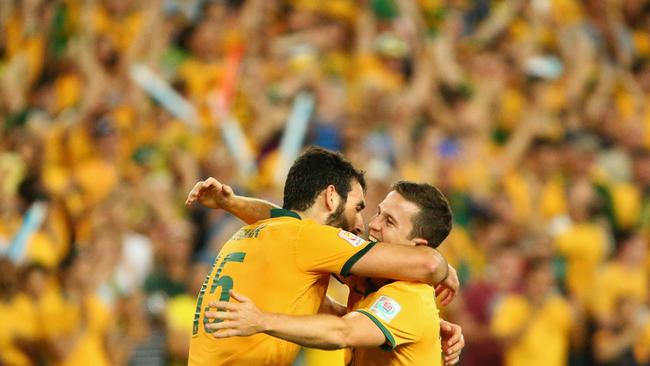 SYDNEY, AUSTRALIA - JANUARY 31: Mile Jedinak and Matt McKay of Australia celebrate victory during the 2015 Asian Cup final match between Korea Republic and the Australian Socceroos at ANZ Stadium on January 31, 2015 in Sydney, Australia. (Photo by Mark Kolbe/Getty Images)