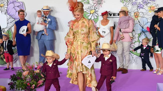 Matching maroon suits and cowboy hats? Another best dressed contender. Picture: James Ross/AAP.