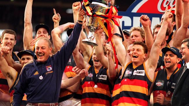 The Crows hold the premiership cup aloft in 1998.