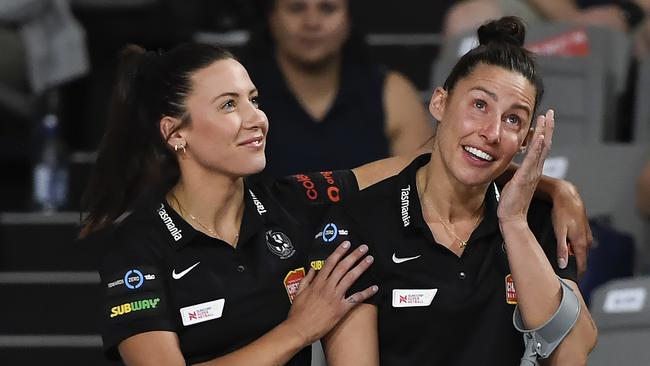 Madi Browne (right) is consoled by her sister Kelsey after the end of her Super Netball career. Picture: Albert Perez/Getty Images