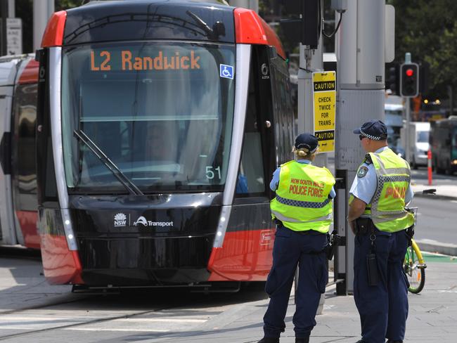 Police have been cracking down on pedestrians disobeying traffic signals near the new light rail route. Picture: Simon Bullard/Daily Telegraph