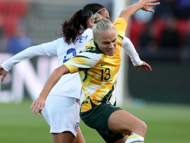 The Matildas’ Tameka Yallop is challenged by Chile’s Francisca Lara. Picture: AAP