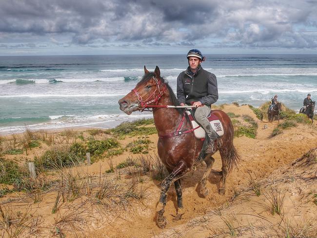 The Darren Weir-trained Raw Impulse and Tyson Kermond after a dunes session at Levys Beach. Picture: Colleen Petch