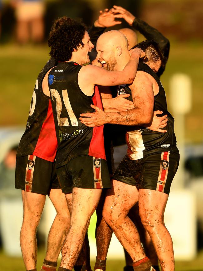 Ablett is congratulated by team mates after kicking a goal. Photo by Josh Chadwick