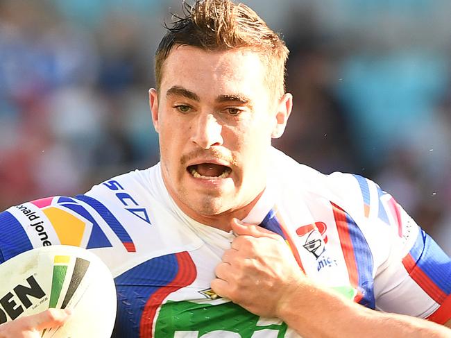 Connor Watson of the Knights is tackled during the Round 11 NRL match between the Gold Coast Titans and the Newcastle Knights at CBUS Super Stadium at Robina on the Gold Coast, Saturday, May 19, 2018. (AAP Image/Dave Hunt) NO ARCHIVING, EDITORIAL USE ONLY