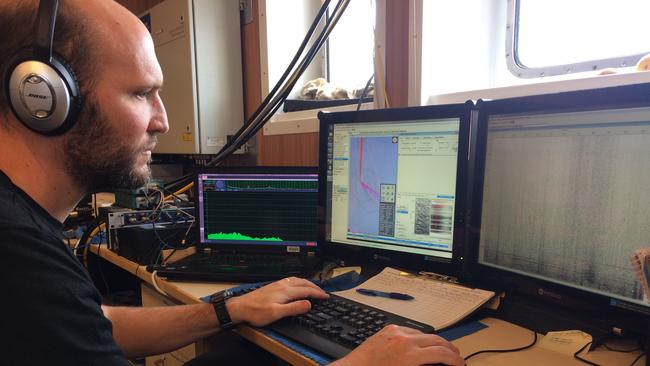 Dr Brian Miller monitors sounds from a sonobuoy for Antarctic blue whale calls. Picture: Elanor Miller/Australian Antarctic Division