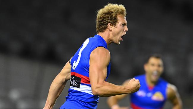 Mitch Wallis celebrates one of the few bright moments for the Bulldogs on a dirty night.