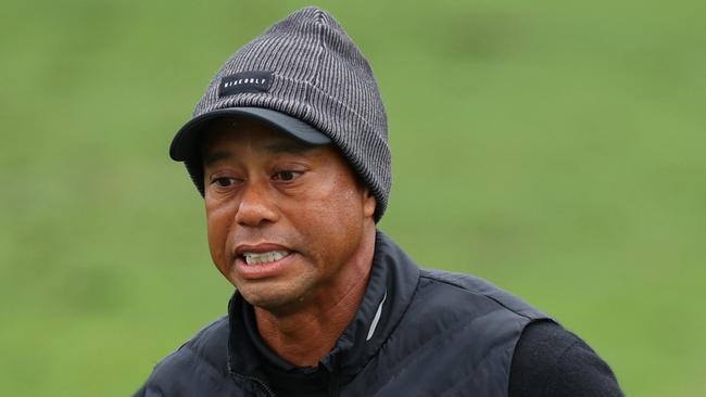 AUGUSTA, GEORGIA - APRIL 08: Tiger Woods of the United States reacts on the practice area prior to his third round of the 2023 Masters Tournament at Augusta National Golf Club on April 08, 2023 in Augusta, Georgia. (Photo by Andrew Redington/Getty Images)