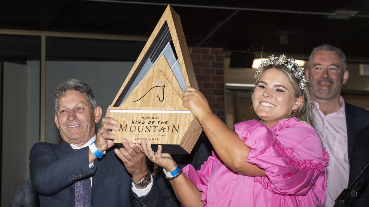 Tony and Maddysen Sears hold the King of the Mountain trophy after Yellow Brick's win at Clifford Park race course. Saturday, December 31, 2022. Picture: Nev Madsen.