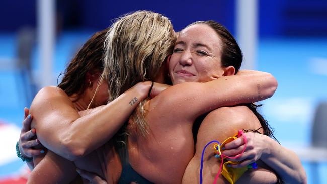 NANTERRE, FRANCE - AUGUST 01: Lani Pallister of Team Australia embraces teammates after winning gold in the Women's 4x200m Freestyle Relay Final on day six of the Olympic Games Paris 2024 at Paris La Defense Arena on August 01, 2024 in Nanterre, France. (Photo by Maddie Meyer/Getty Images)