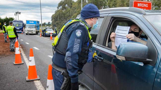 Generic image: Police officers checking drivers at the Gisborne South checkpoint in July.