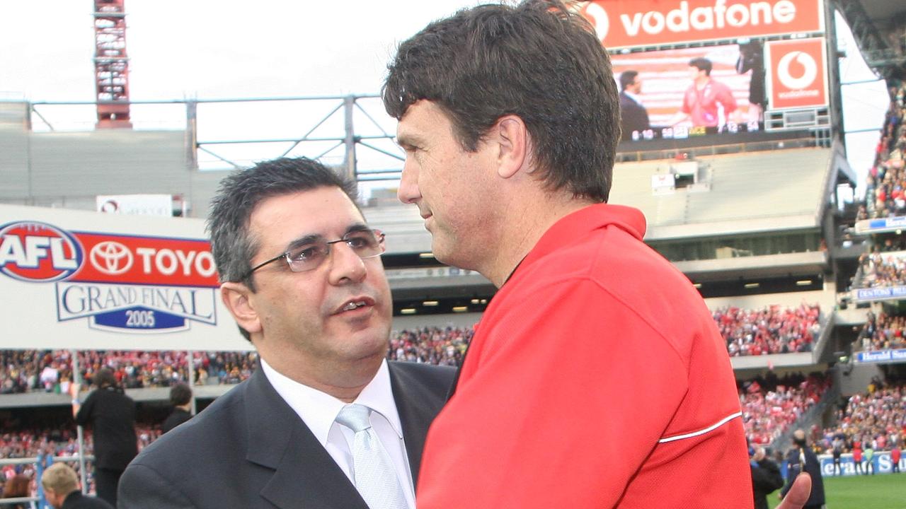 Swans Coach Paul Roos shakes hands with AFL CEO Andrew Demetriou. Photo by Quinn Rooney/Getty Images.