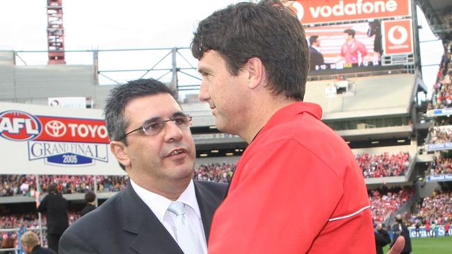 Swans Coach Paul Roos shakes hands with AFL CEO Andrew Demetriou. Photo by Quinn Rooney/Getty Images.