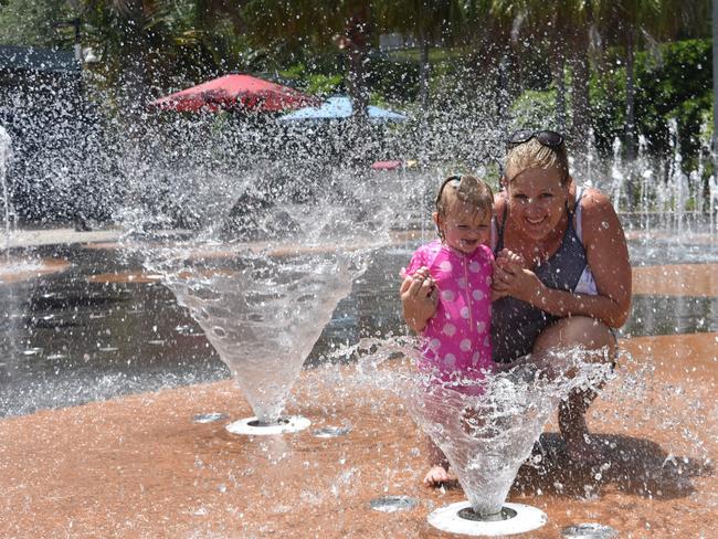 Tracey and Hunter, 1, Gravett are spending the day under the sprinklers at East Shores water play park.