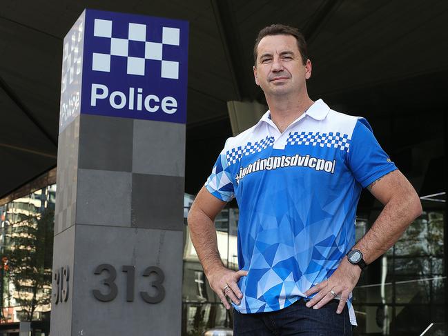 Detective Acting Sgt Glenn Holland outside Police HQ in Spencer Street.Glenn is raising money for a dedicated hospital ward for police suffering PTSD. Picture : Ian Currie