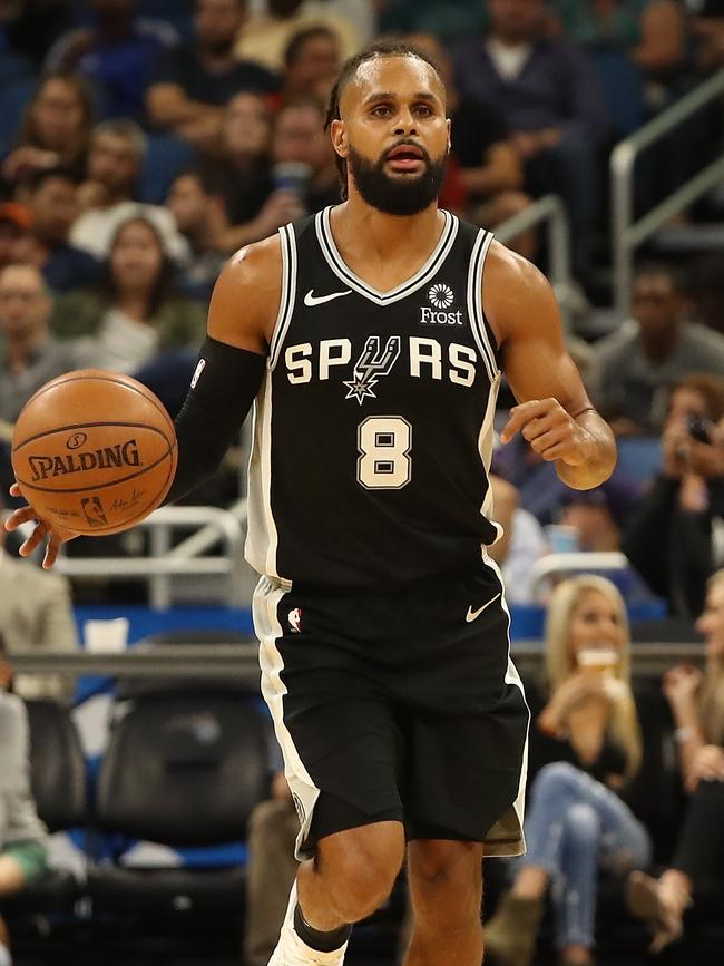 Patty Mills has his hands full at the moment. (Sam Greenwood/Getty Images/AFP)