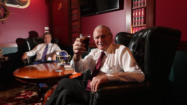 Barrister Chris Garlick watches on as Will "the Wrecker" Smith toast success in the courts, at his Southport Chambers. Picture: Glenn Hampson.