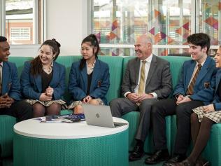 Catholic Education South Australia director Neil McGoran with year 12 students at Mount Carmel College