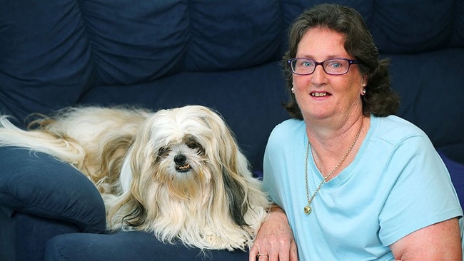 Geelong woman Janelle Blythe with her dog Scottie. Ms Blythe has suffered chronic pain for the past 30 years.
