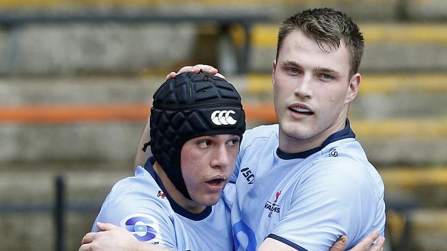 Brendan Palmer being congratulated by Charlie O'Kane.