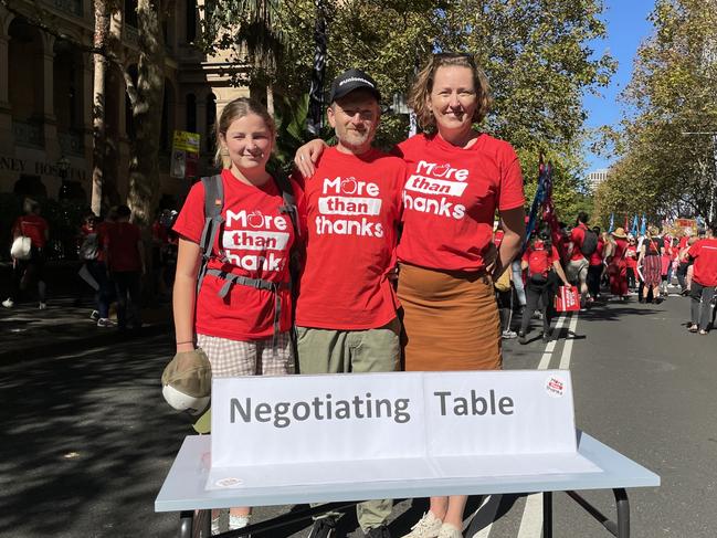 Student Ella Loades, Keira High School deputy principal Trystan Loades and Illawarra Teachers Association vice president Tash Watt took the “negotiating table” to NSW Parliament. Picture: Dylan Arvela