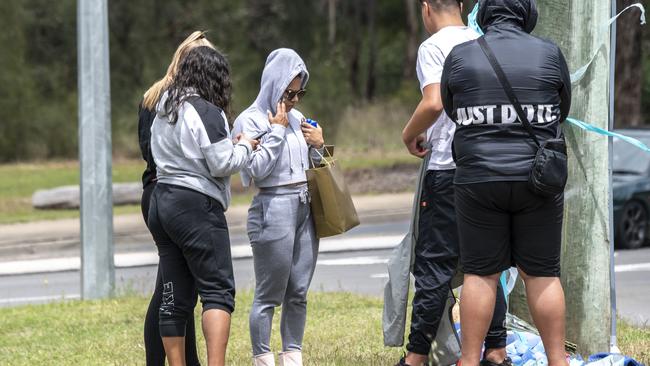 Friends gather at the memorial of the two teenagers. Picture: Monique Harmer