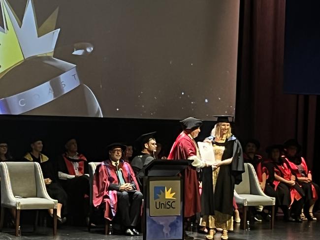 Graduates from the University of the Sunshine Coast's Fraser Coast campus celebrating at the Brolga Theatre.