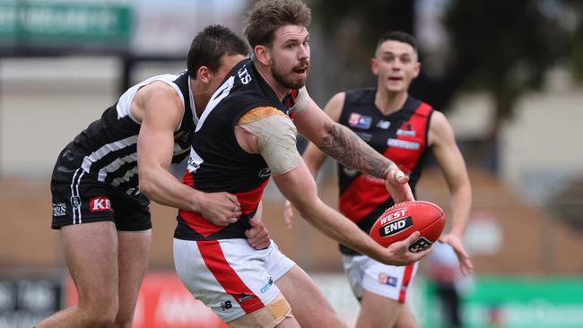 Former West Adelaide captain Kaiden Brand is tackled by Port Adelaide’s Ollie Lord during his last game for the Bloods in Round 15, 2022. Picture: David Mariuz/SANFL