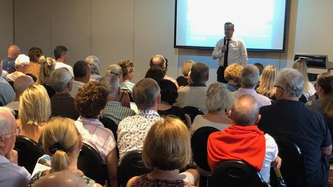 Councilor Cameron Caldwell faces a packed crowd at the Currumbin RSL Meeting.