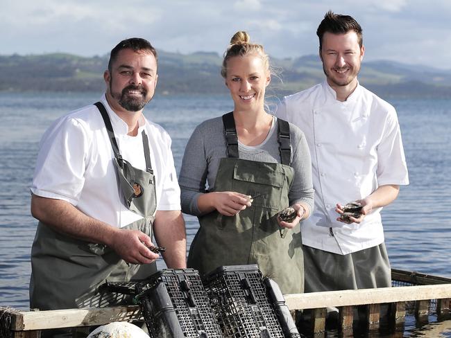 TAS WEEKEND: Harvest shoot: Blackman Bay Oyster Farm co-owner, Isabelle Clarkson (centre) with Hobart restaurant, Aloft chefs, Glenn Brynes (centre) and Christian Ryan at Blackman Bay PICTURE: Luke Bowden