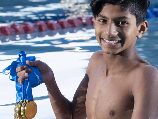 The Prasad siblings, won a total of 16 gold, seven silver and nine bronze medals at the recent Fiji Swimming Nationals. Brendan Prasad 13 with his medals. Photographed 26th July 2018.  (AAP IMAGE/Matthew Vasilescu)