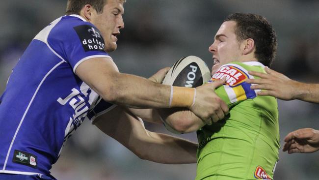 Nathan Massey (right) in action in the NRL in 2011.