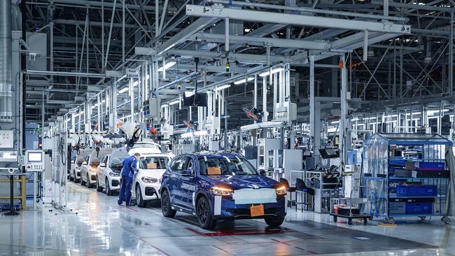 BMW iX3 electric SUV on the production line.