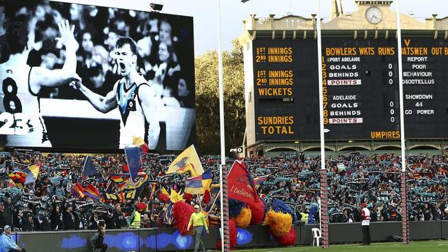 The Crows cheer squad during the Never Tear Us Apart anthem. Picture SARAH REED