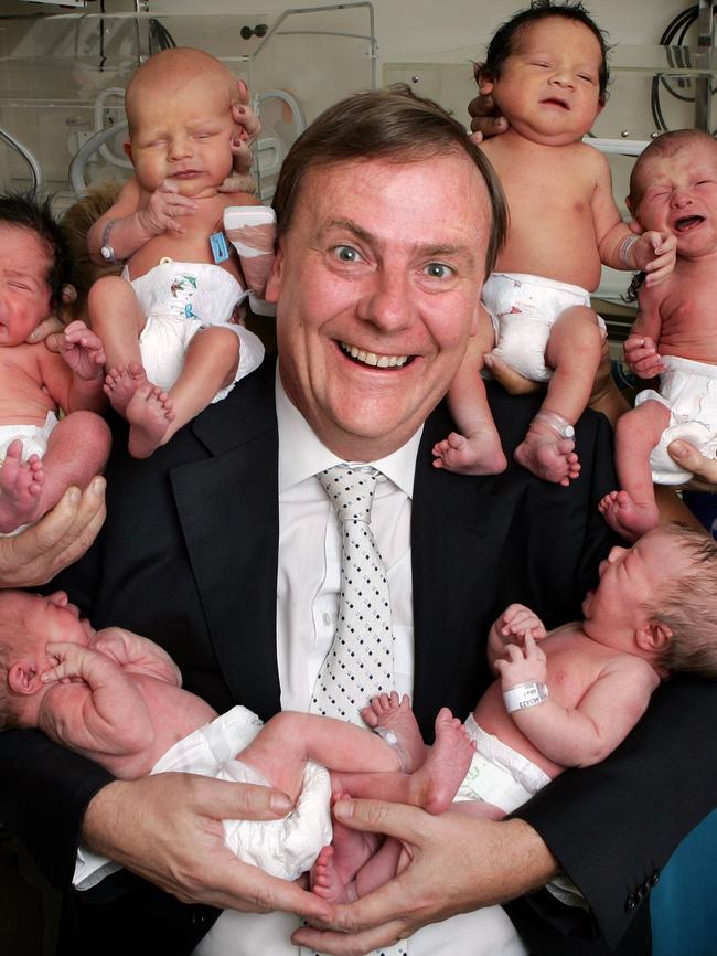 Former treasurer Peter Costello’s iconic line urging Australians to have “one child for mum, one for dad and another for the country” saw him pose with newborn babies at the Royal Women’s Hospital. Picture: David Caird