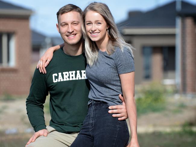 Jess Cosaitis, 25, and his partner Tess Walker, 26, at their recently purchased four bedroom home. Picture: Andrew Henshaw