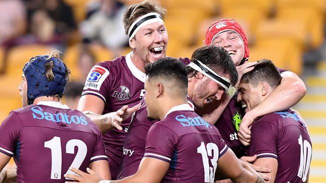 Queensland Reds players celebrates a try to James O’Connor (right). Picture: Getty Images