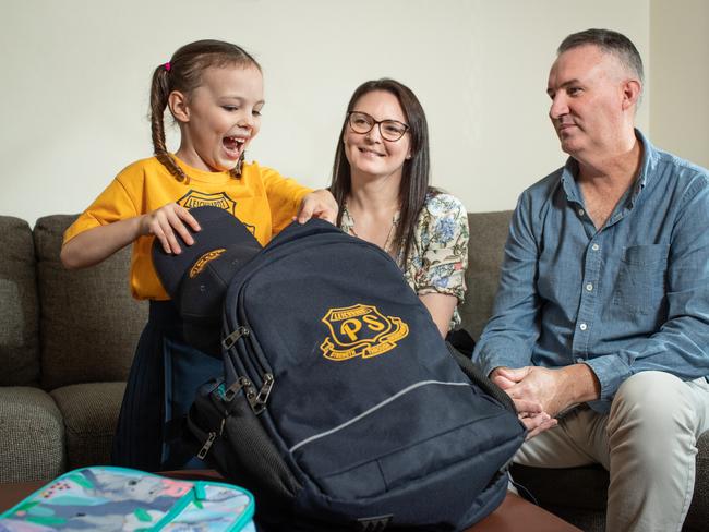 Kirstin and Andrew Hansch have been helping five-year-old daughter Charlotte practise packing her bag for the first day of school. Picture: Julian Andrews