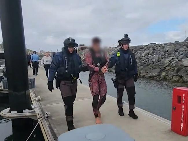 One of the men being arrested after the raid. Pic: Supplied by NSW Police.