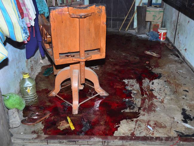 Blood stains the floor of a shop after a militant attack at Balajan Tinali, in the Kokrajhar district of Assam on August 5, 2016. Gunmen opened fire on a busy market in a restive area of northeast India, killing 14 and wounding several others, police said. / AFP PHOTO / STR