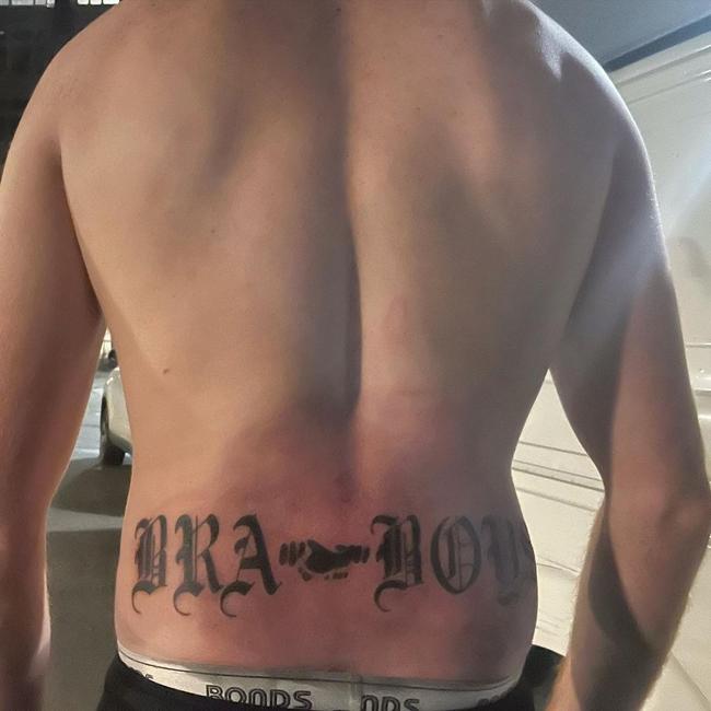 A Bra Boy with his lower back tattoo.