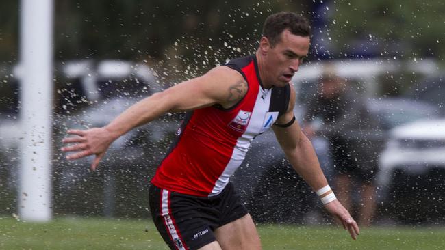 Heath Decker chases after the ball. Picture: Richard Serong