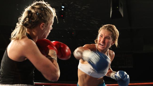 Boxers Maline Morgan (L) and Lauryn Eagle during a bout in the Friday Night Fights which use to be held at The Roundhouse.